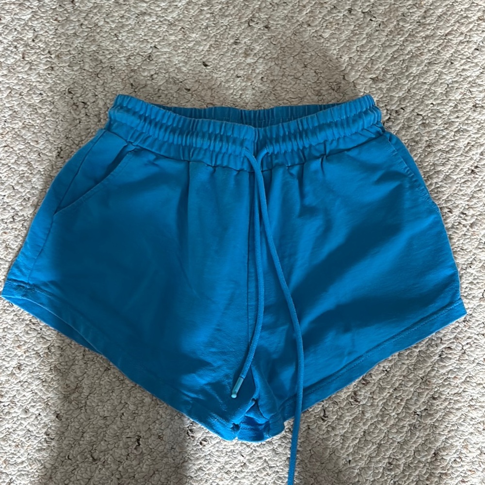 Blue Athletic Shorts with Elastic Waistband and Curved Hem